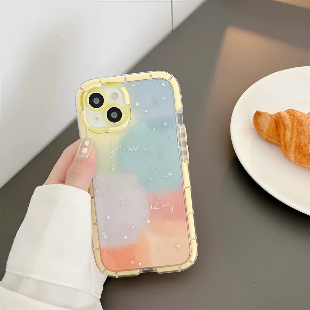Minimalist two-tone silicone iPhone case with a yellow edge, shown on a phone.