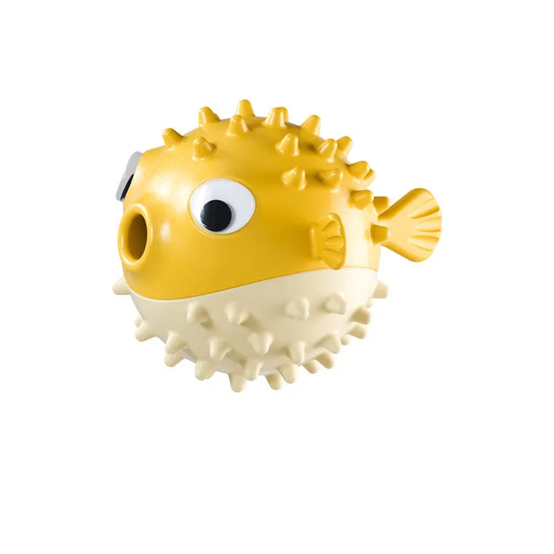 Green fish-shaped interactive dog chew toy with textured surface for treat dispensing