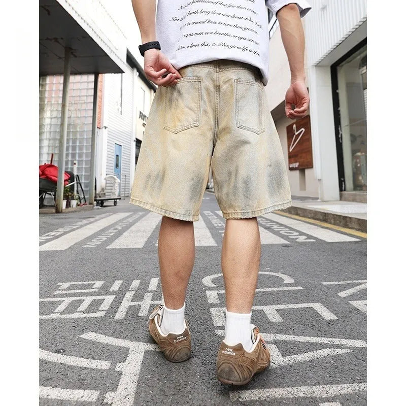 Light blue men's denim shorts with ripped details and a straight-leg fit