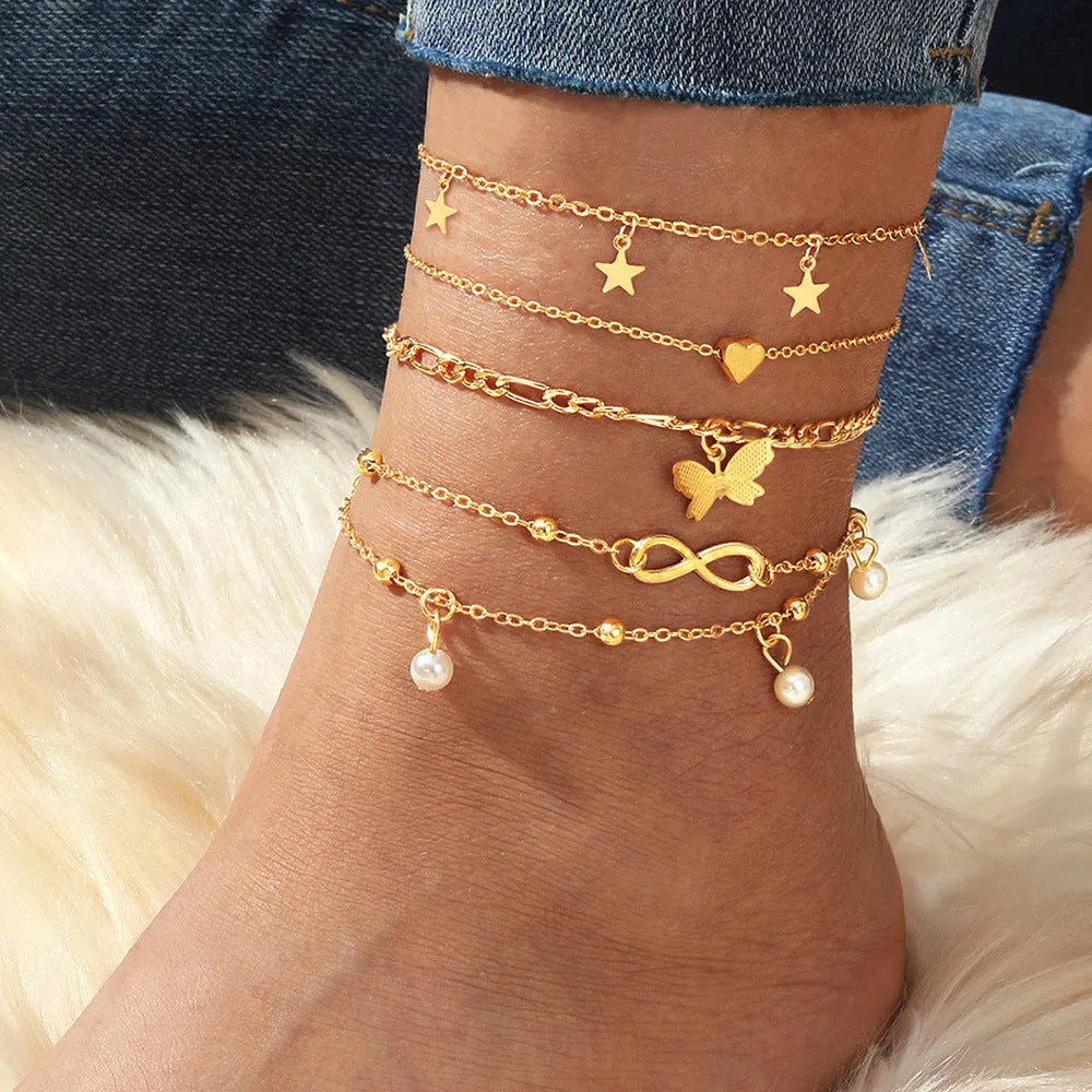 Butterfly pearl heart women's anklet set showing four layered alloy foot chains with butterfly and heart charms
