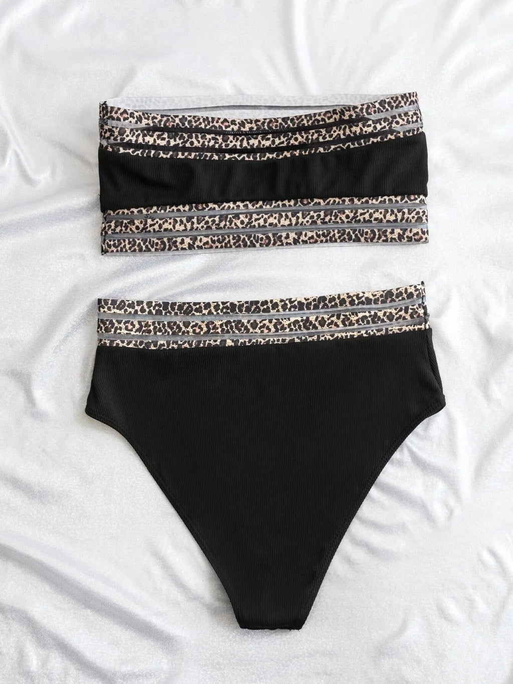 Black leopard print strapless swimsuit with two-piece design on mannequin