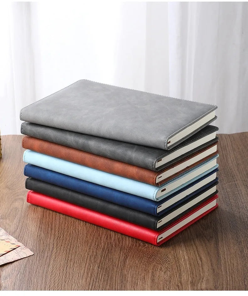 A5 notebook with PU leather cover in choice of colour, shown open on wood-free paper pages.