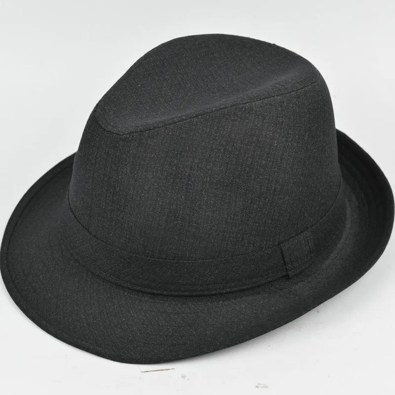 Classic brown fedora hat with structured crown and wide brim on a wooden stand