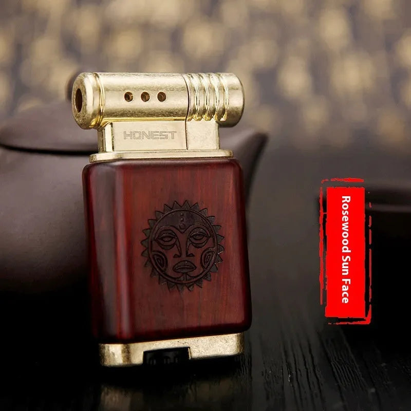 A decorative gas lighter with a carved wooden handle combining black wood, rosewood symbols, and a red wood tube accent.