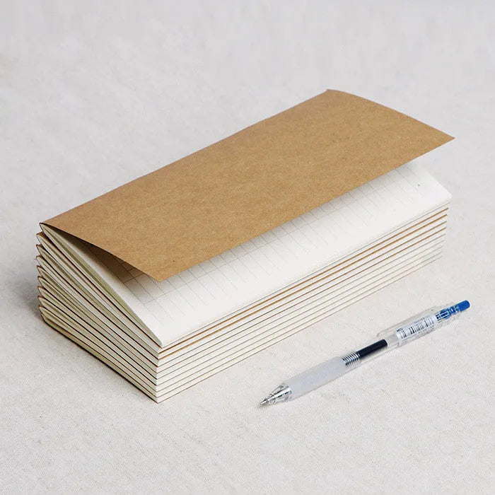 Diary refill inner core showing saddle stitch binding and 11x21cm dimensions