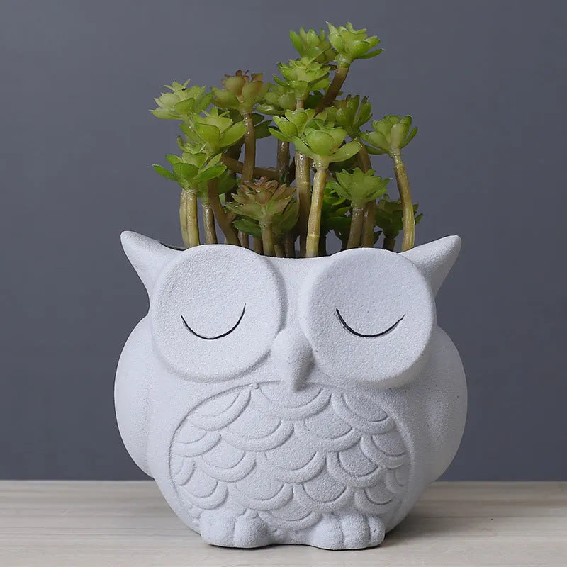 Handmade frosted owl ceramic succulent pot in light pink, showing cartoon design and 11cm size.