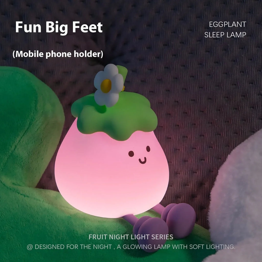 Cartoon eggplant small night lamp with soft yellow light beside broccoli design night light