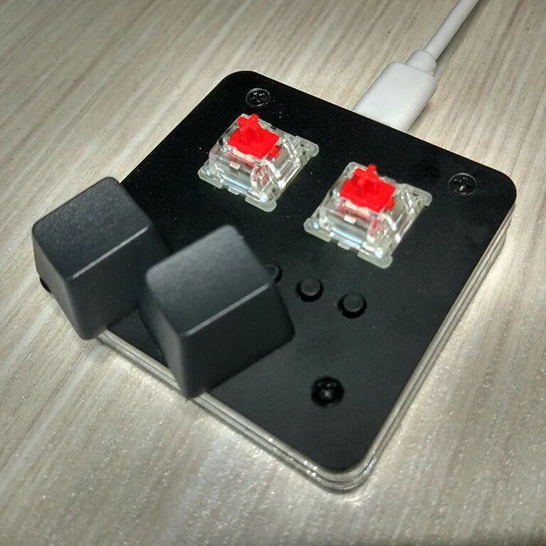Mini wired USB keyboard in black with multimedia function keys and a compact plastic design.