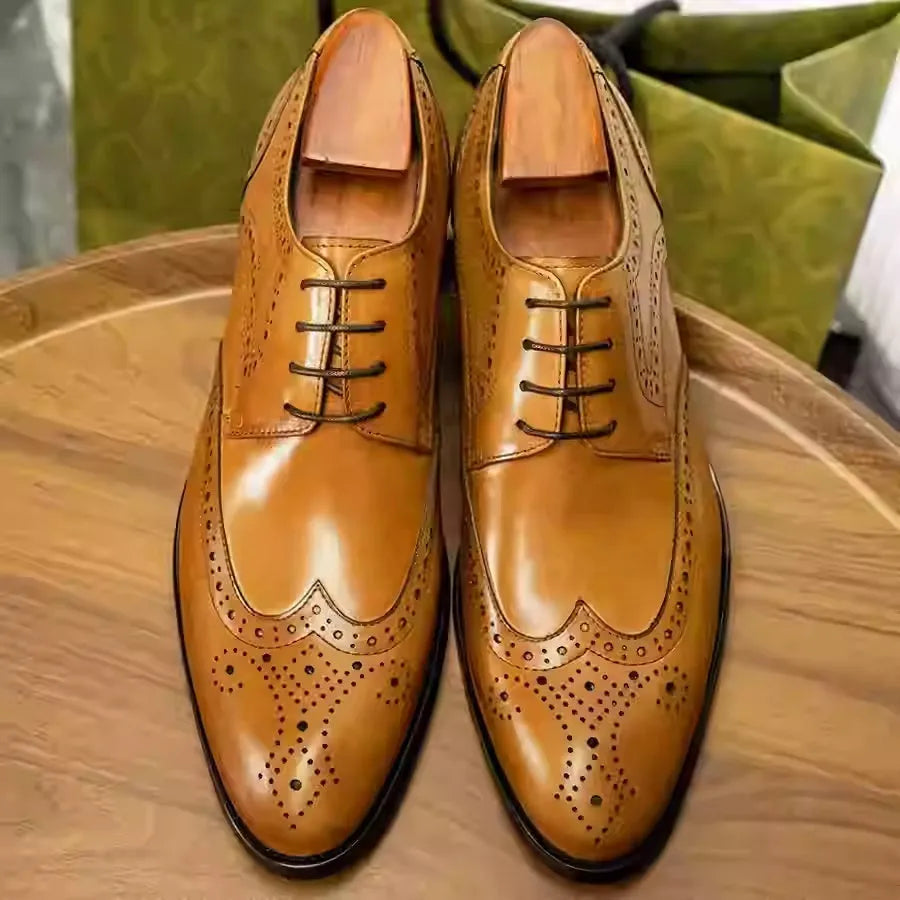 Men's black pointed toe Oxford leather shoes with carved brogue patterns and low heel