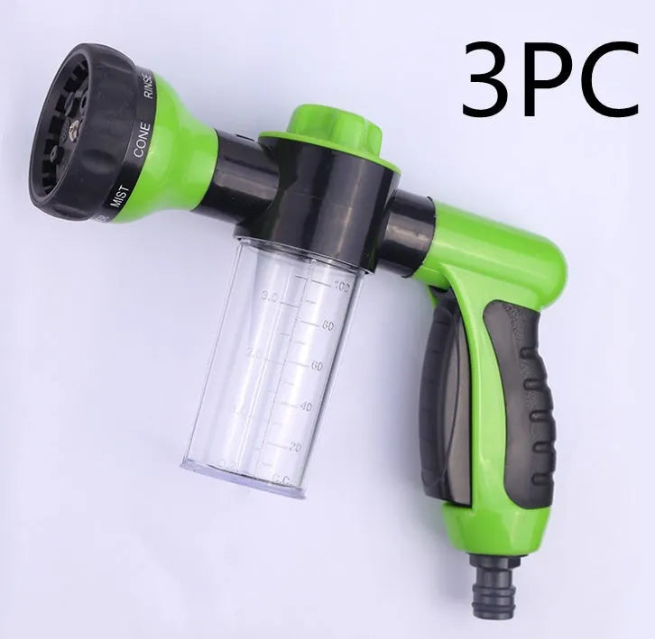 Green high-pressure foam spray gun for car washing with adjustable nozzle and attached water pipe.