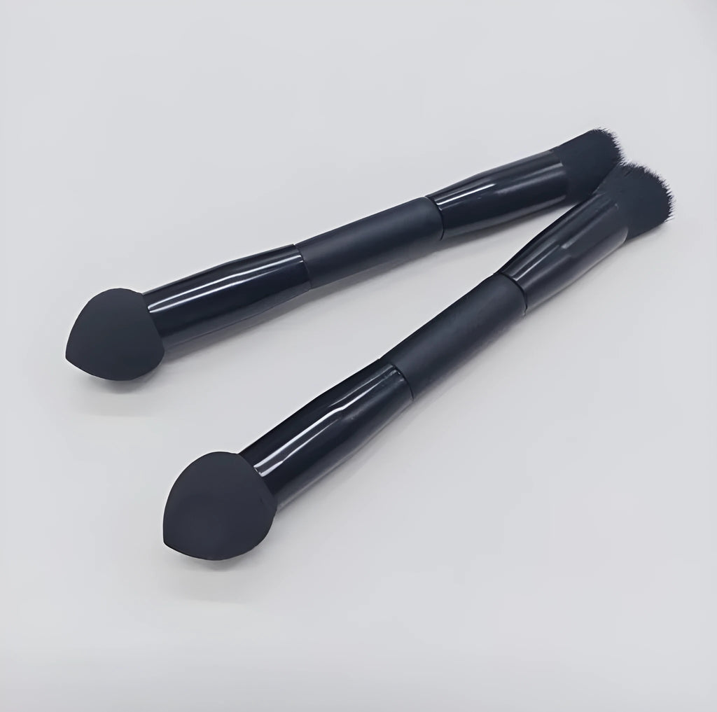 Double-headed concealer brush with black wooden handle, artificial fibre bristles, and angled sponge tip.