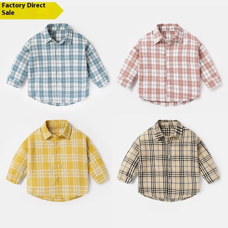 A boys' long sleeve cotton shirt with a lattice and cartoon pattern, shown in a light blue colour.