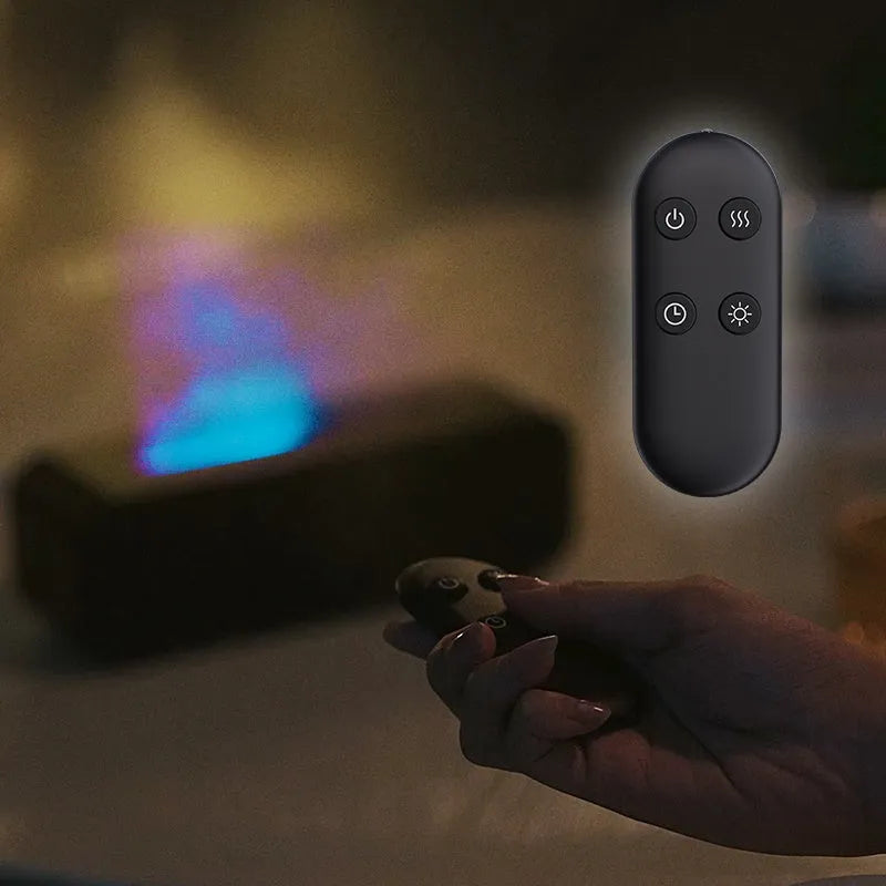 Black and white aromatherapy diffuser with flame LED effect and remote control on wooden surface