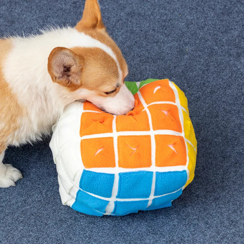Pet Rubik's Cube sniffing toy in polar fleece fabric with treats visible, 15cm cube on a light background