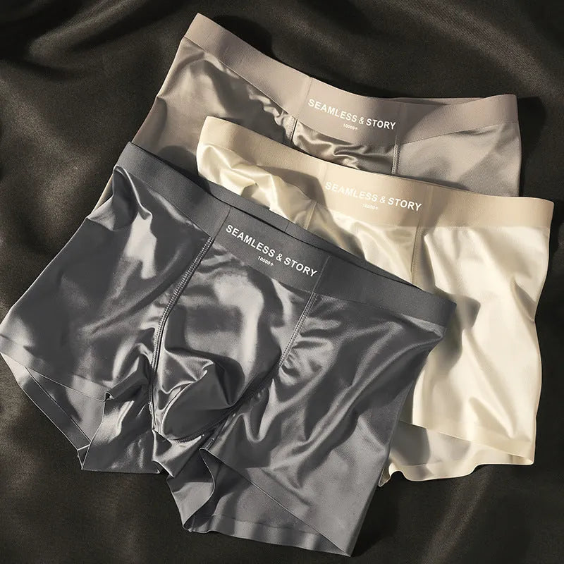 Men's ice silk underwear in multiple colours showing mid-waist design and smooth fabric texture