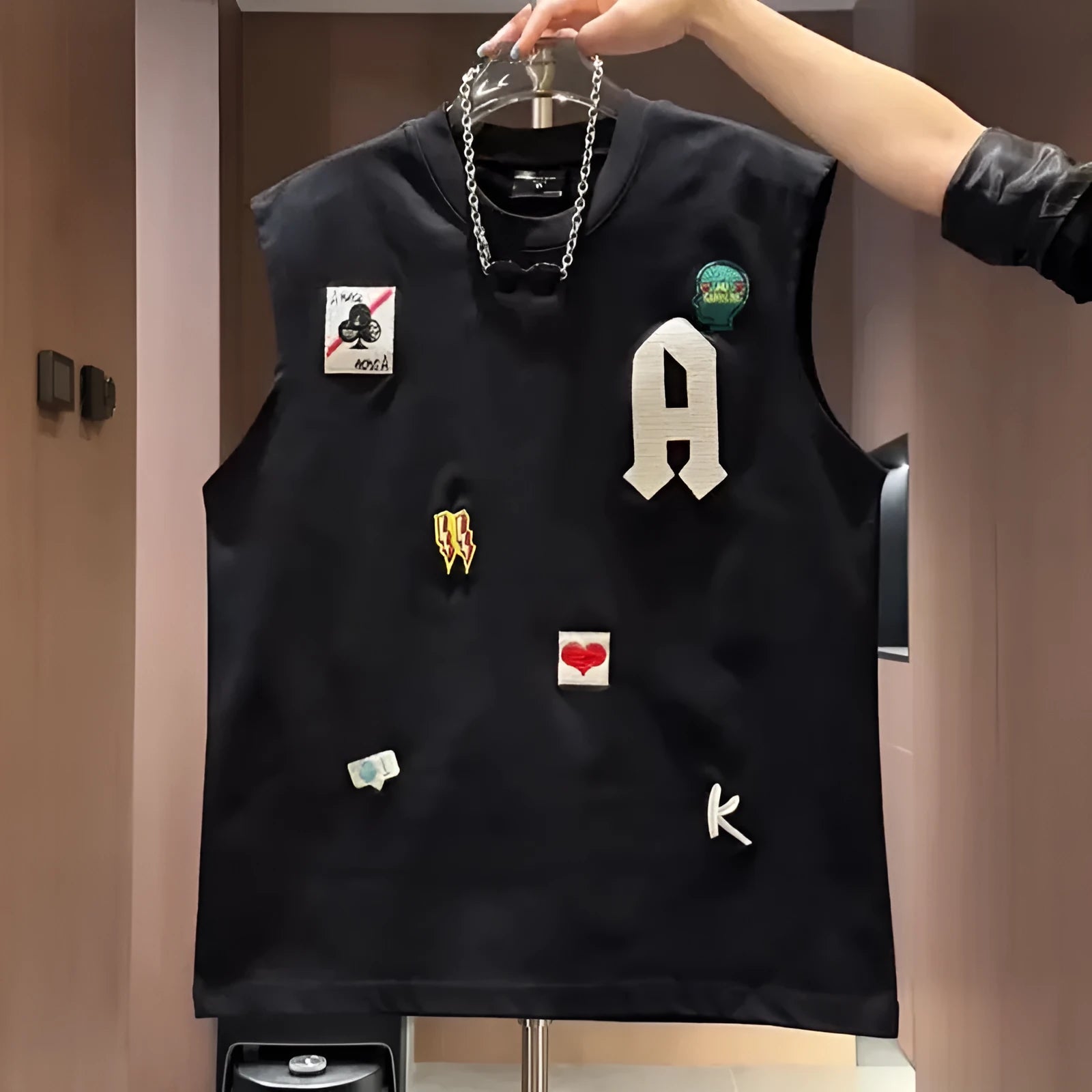 Men's black cotton sleeveless vest t-shirt featuring a cartoon graphic print.