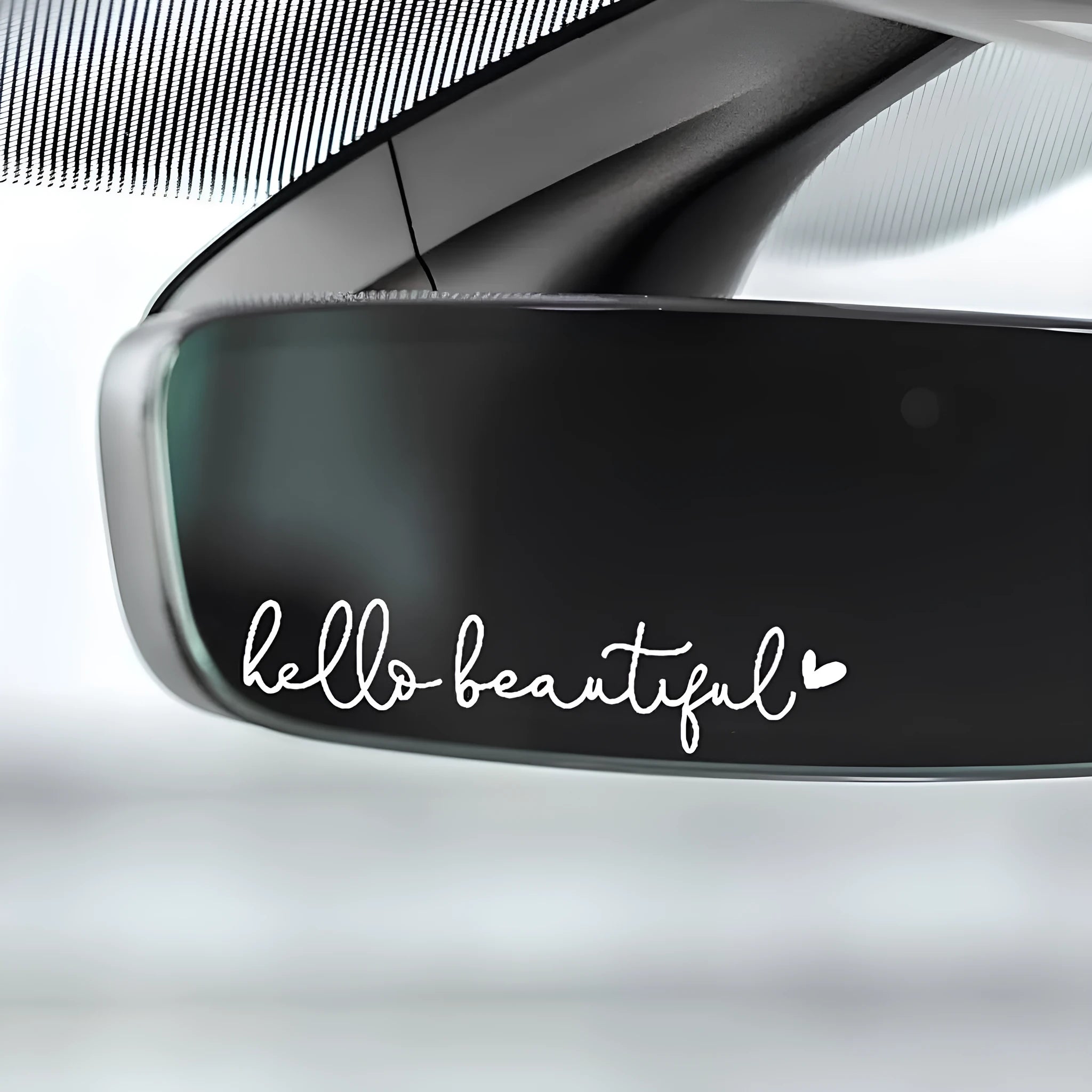 Plastic rearview mirror sticker 10x3cm in black on a car mirror