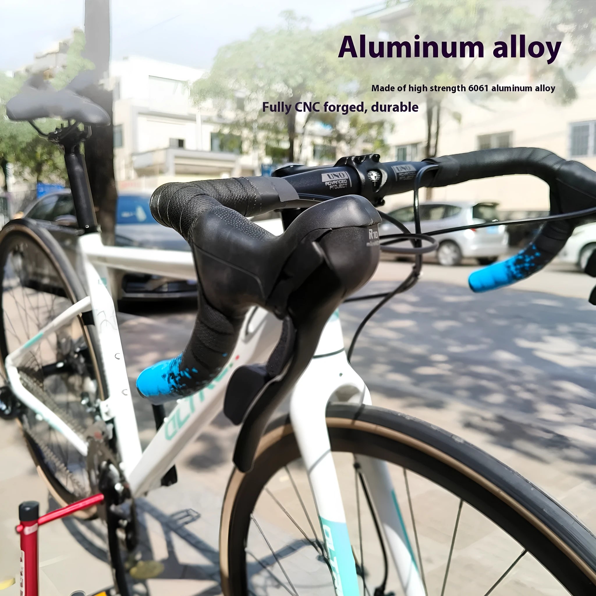 Black aluminium alloy road bike drop handlebar with UNO printing marks showing multiple width options
