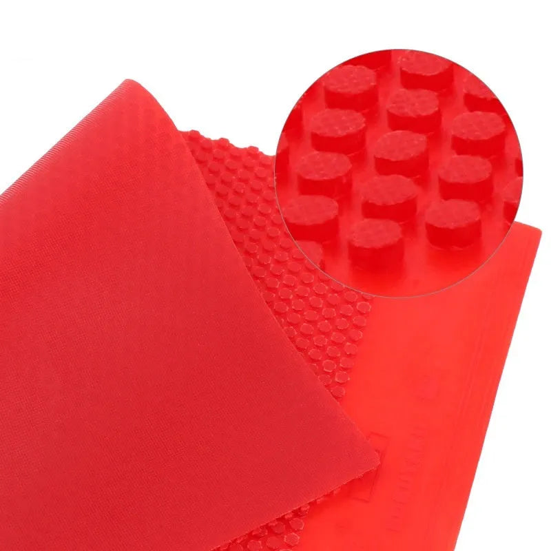 Single sheet of black and red small particle table tennis racket rubber.