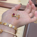 Retro two-tone geometric cross ring with a double-headed design and group diamond setting.
