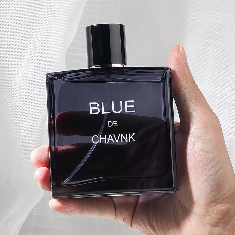 Men's perfume bottle in Black or Blue with woody sandalwood and cedar notes, available in 100ml, 50ml, and 30ml