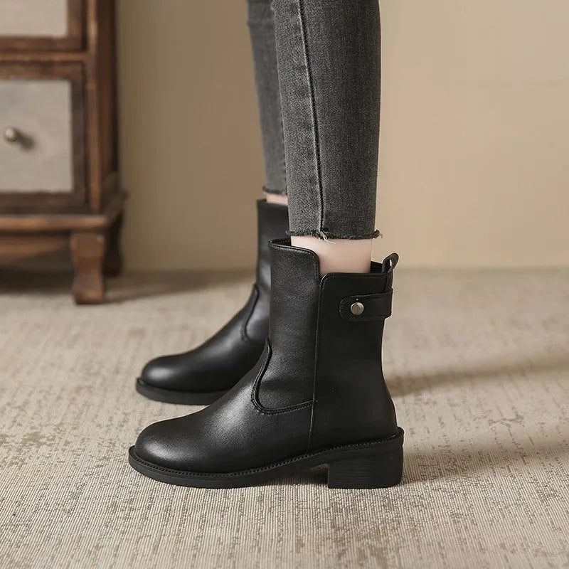 Women's black low heel round toe side zip ankle boots showing front and side views
