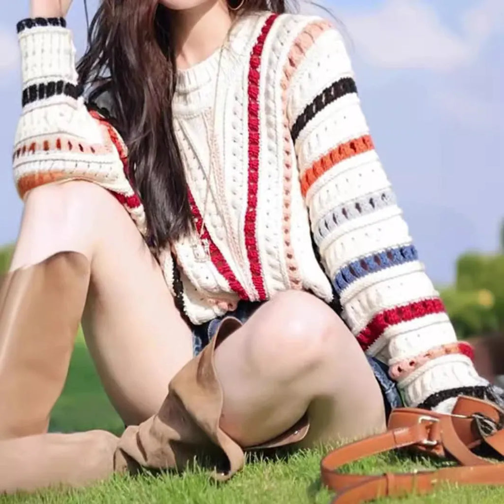 Retro rainbow striped loose sweater with batwing sleeves and a round neck.