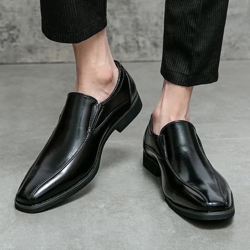 Men's black patent leather pointed toe shoes with a flat rubber sole and leather lining.