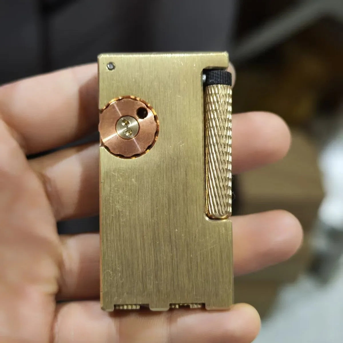 Brass metal lighter with copper flint warehouse and side sliding ignition mechanism