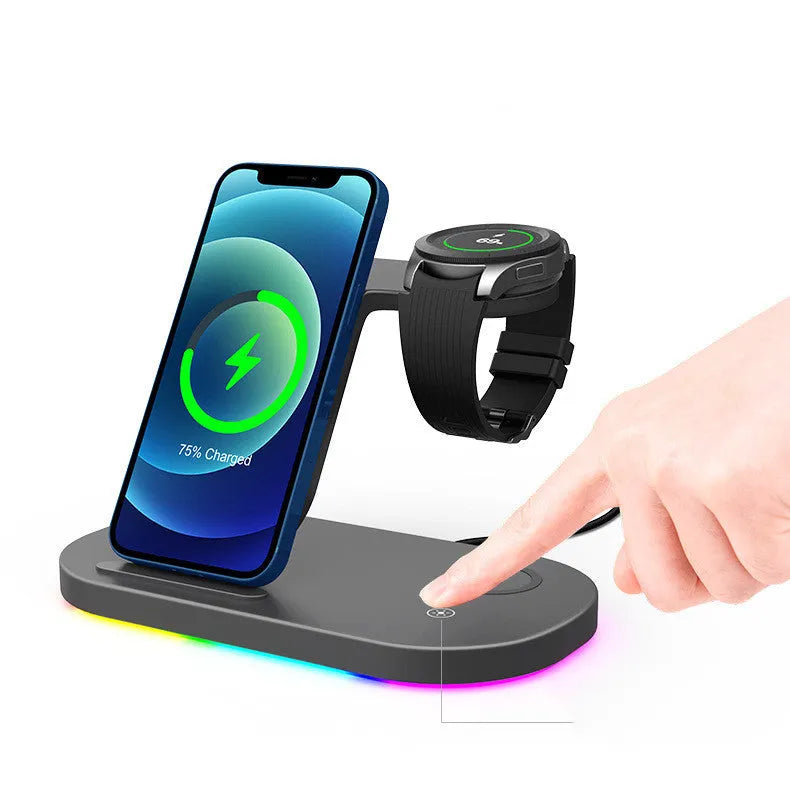 Black three-in-one wireless charging station with phone, watch and accessory on charging surfaces