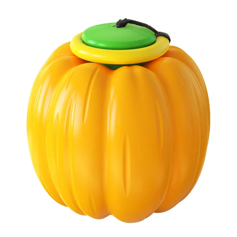 Small orange plastic pumpkin dog ball with squeaker for puppy chewing and training
