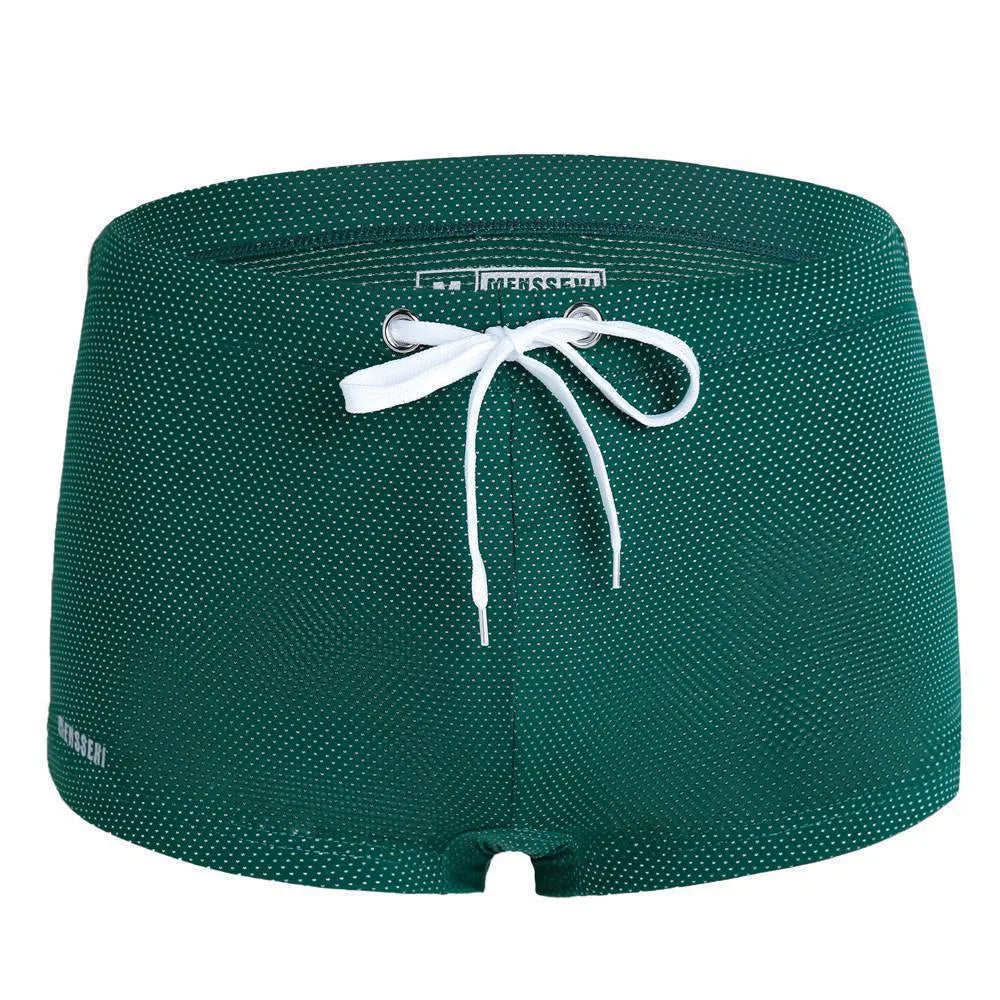 Men's solid colour nylon lace low waist swimming trunks in boxer briefs style.