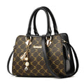 Women's geometric print messenger bag in PU leather with crossbody strap and zipper closure