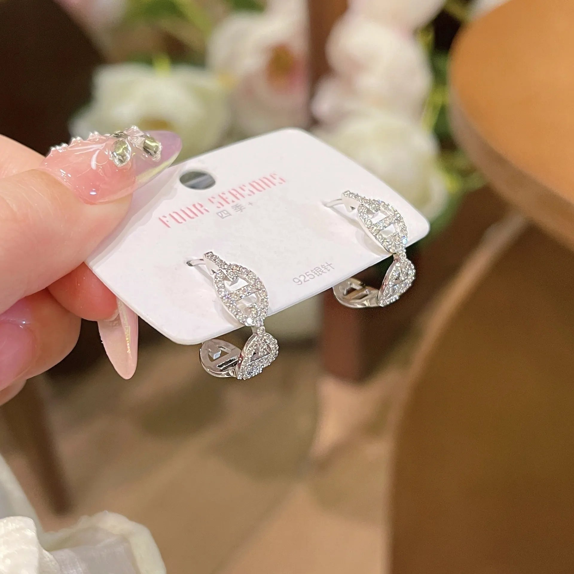 Ladies casual drop earrings with diamond design in silver, gold, or rose gold electroplated finish.