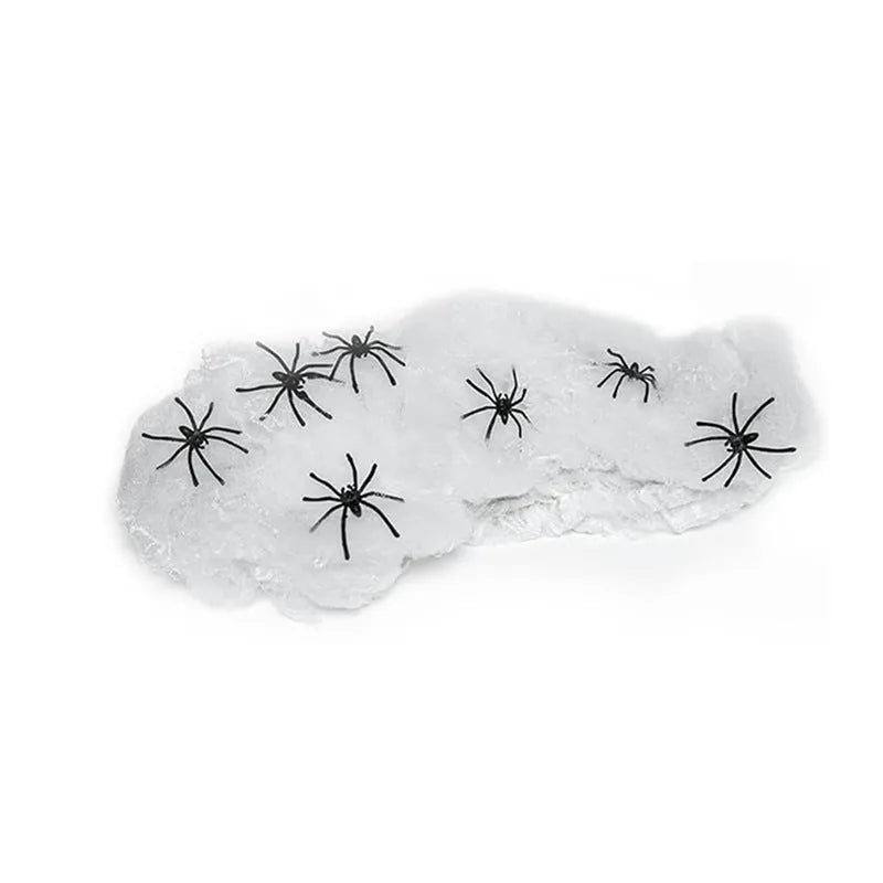 Halloween cotton spider web decoration pack with white plastic spiders draped over a branch
