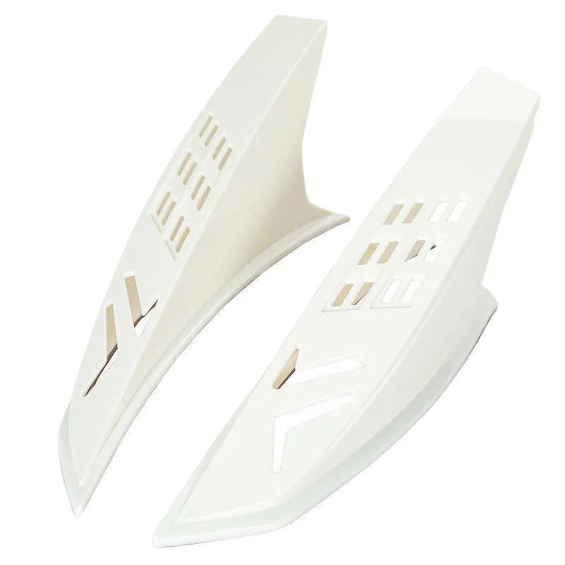 A pair of black plastic decorative horns for children's helmets with visible 3M adhesive backing.