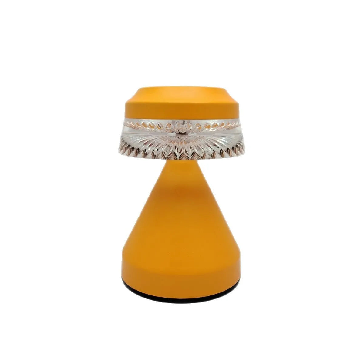 Compact USB rechargeable LED night light in black, brown, and orange colour options on a table.