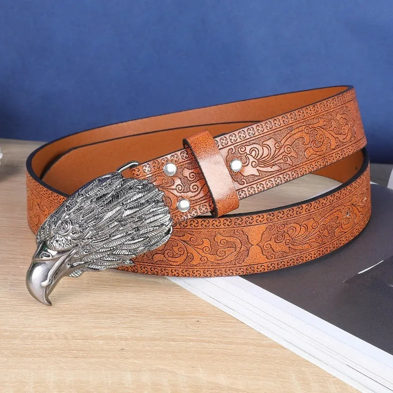 Men's brown imitation leather belt with a detailed silver alloy cow head buckle and pin buckle fastening.