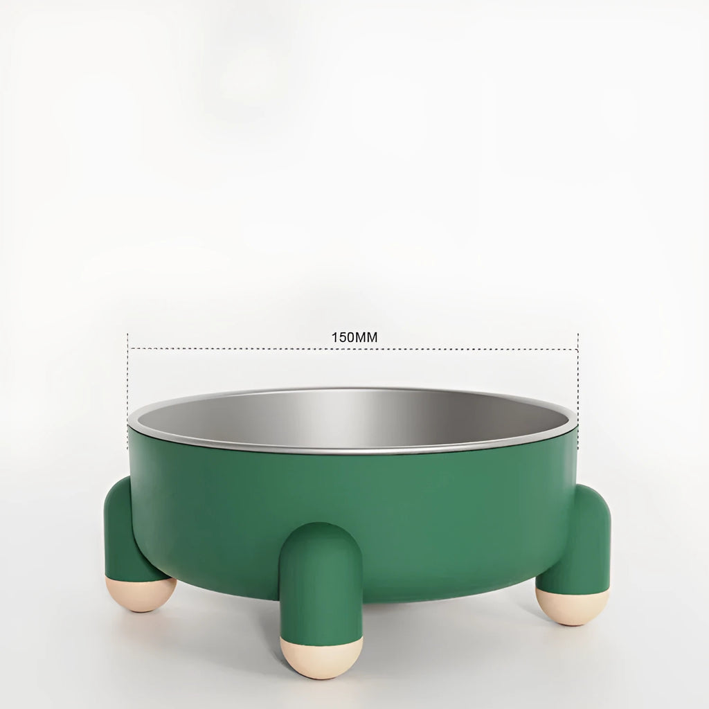 Green non-slip stainless steel pet bowl with high foot base on a floor.