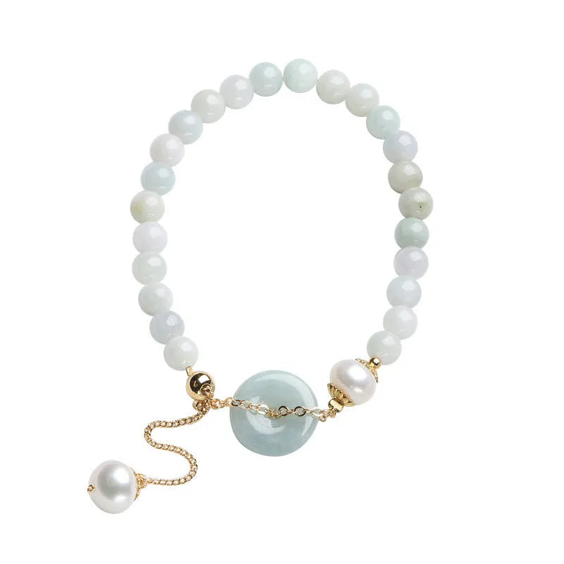 Natural emerald green jade bracelet with pearl accents and peace symbol buckle clasp