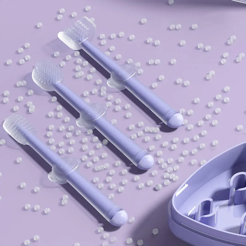 Blue, green, and purple pet toothbrushes with soft silicone bristle heads for dogs and cats.