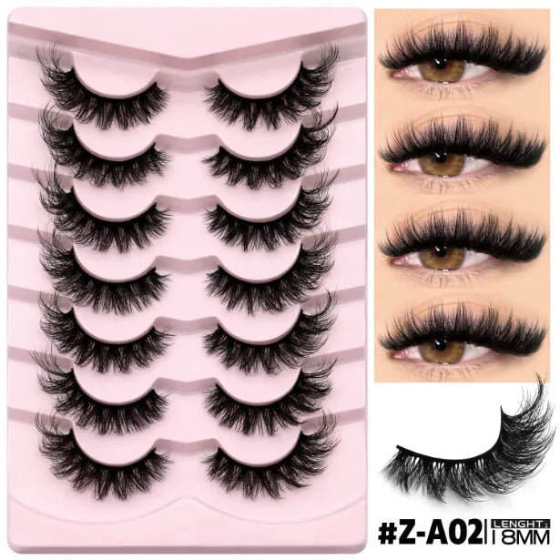 Box of natural false eyelashes with thick artificial fibre lashes and included glue tube