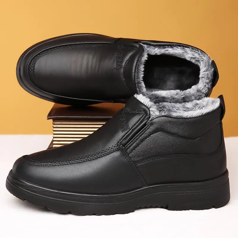 Men's black fleece-lined slip-on winter shoes with a rubber sole shown on a white background.