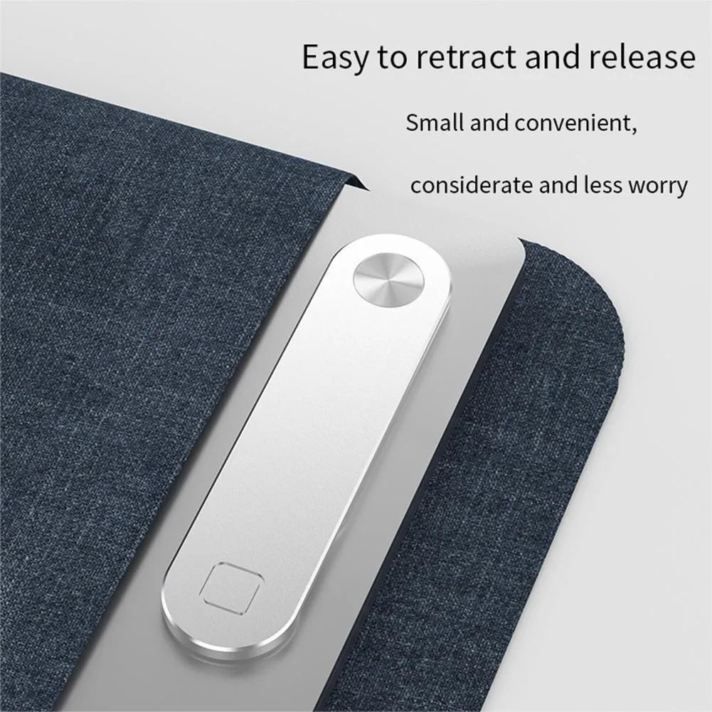 Black aluminium magnetic phone holder mounted on side of laptop screen.