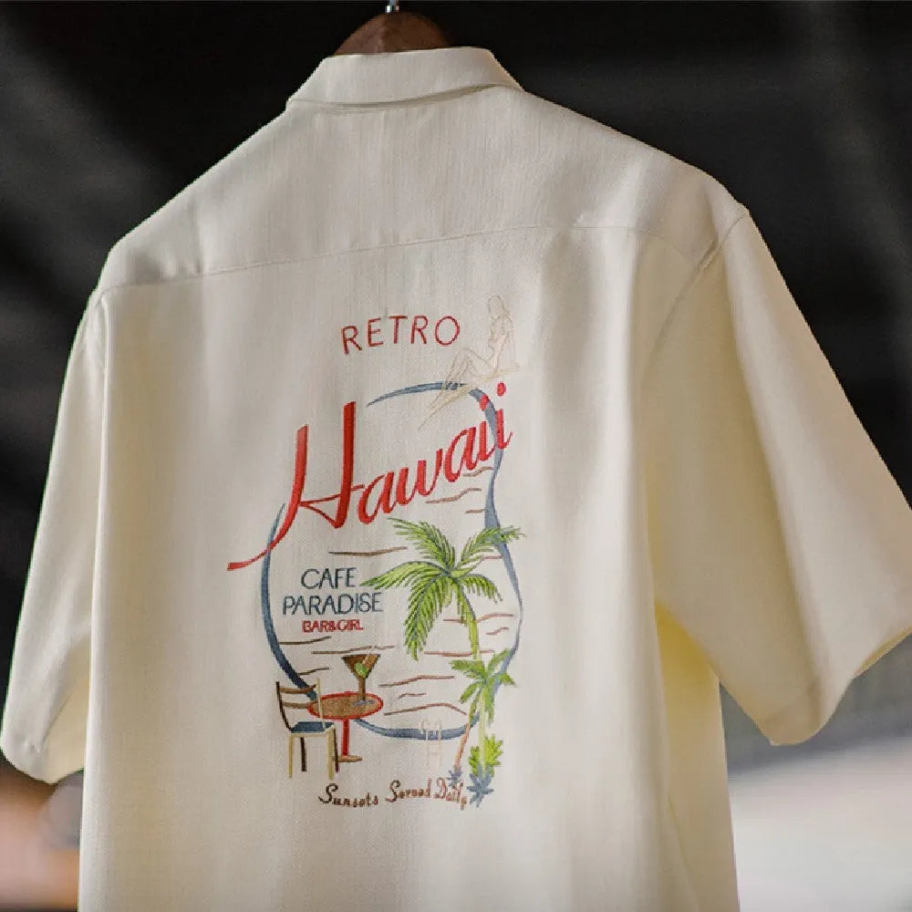 Men's light apricot shirt with bamboo leaf pattern and a Cuban collar on a short sleeve design.