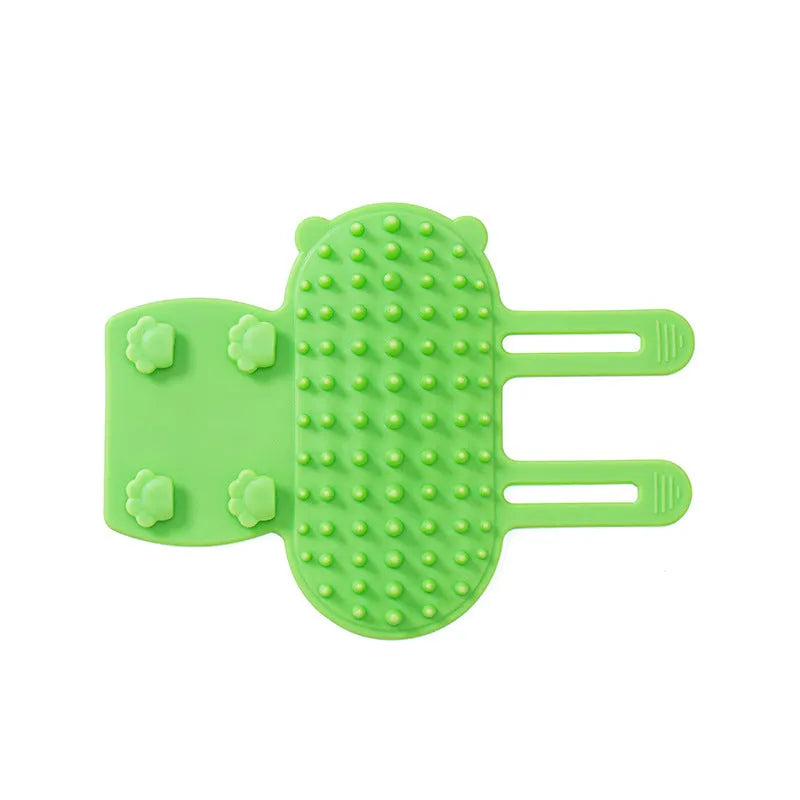 Silicone cat grooming comb with adjustable strap mounted on a furniture leg