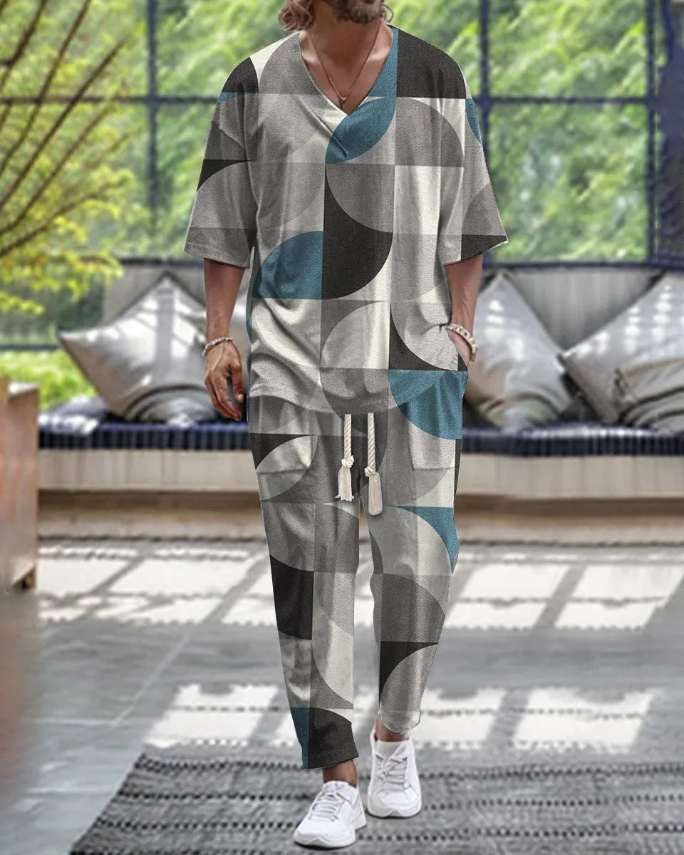 Cropped sleeve V-neck jacket and trousers suit in thin polyester fabric on a hanger.