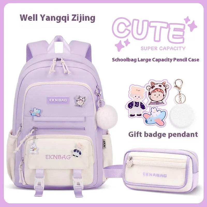 Pink waterproof Oxford cloth school backpack for girls with curved shoulder straps.