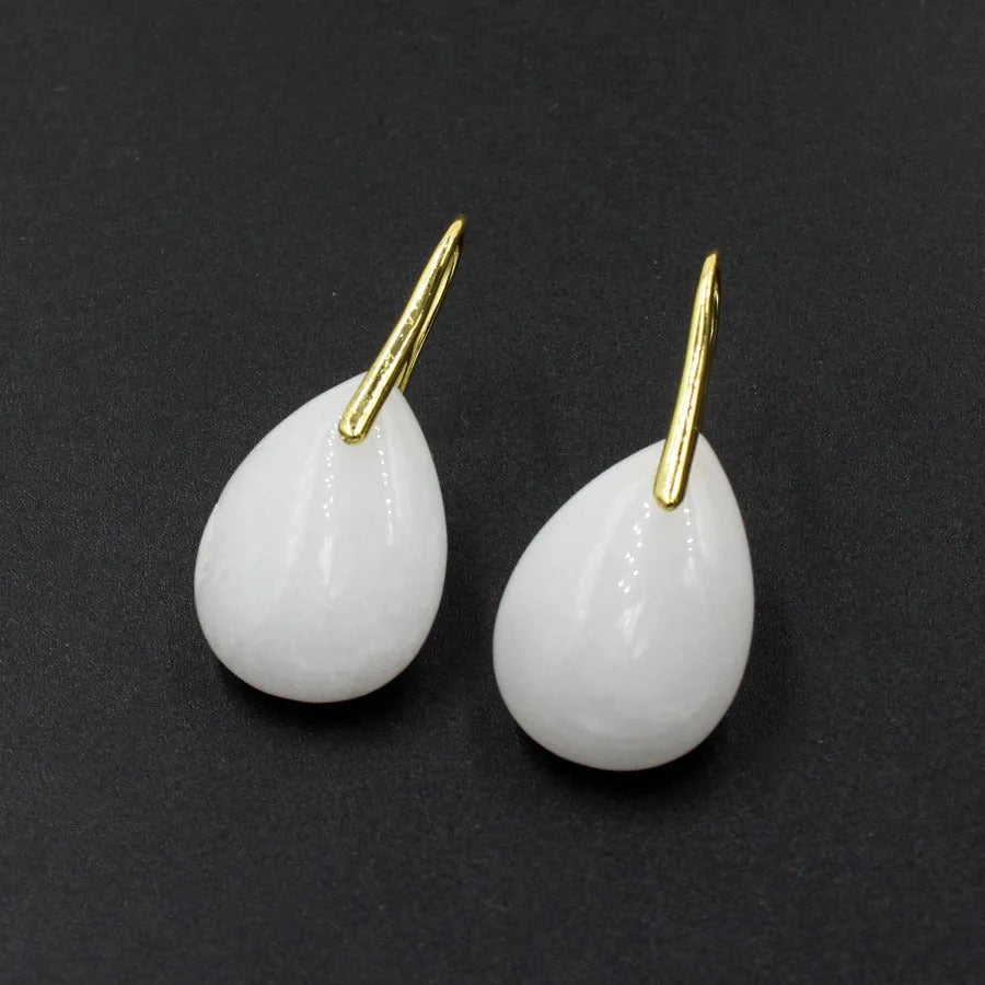 A pair of geometric water drop shaped earrings made from crystal in an electroplated finish.