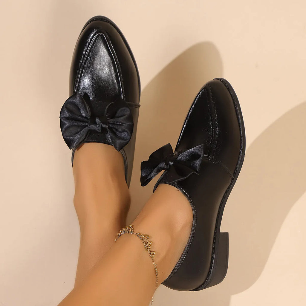 Women's simple leather shoes with a pointed toe and a choice of big bow or small bowknot detail.